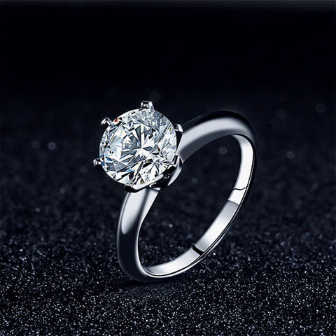  Front view of the elegant 925 silver three-carat moissanite ring, showcasing its stunning glossy finish and classic design