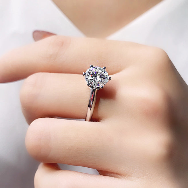 Model wearing the 925 silver three-carat moissanite ring, demonstrating its elegant appearance and suitability for special occasions.
