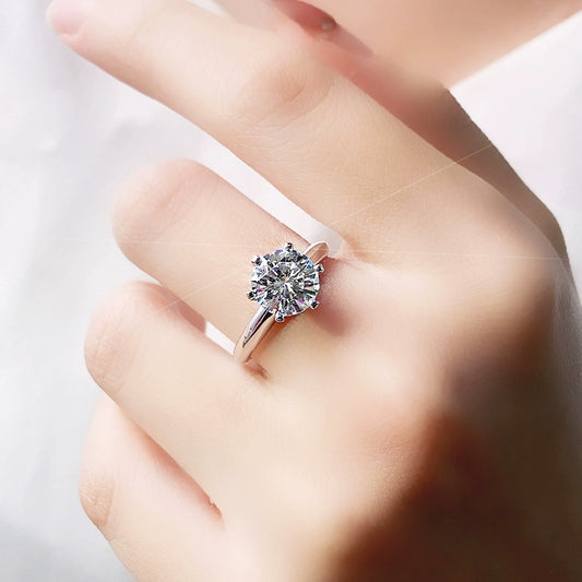 925 silver three-carat moissanite ring displayed on a white background, emphasizing its beauty and craftsmanship in a clean setting.
