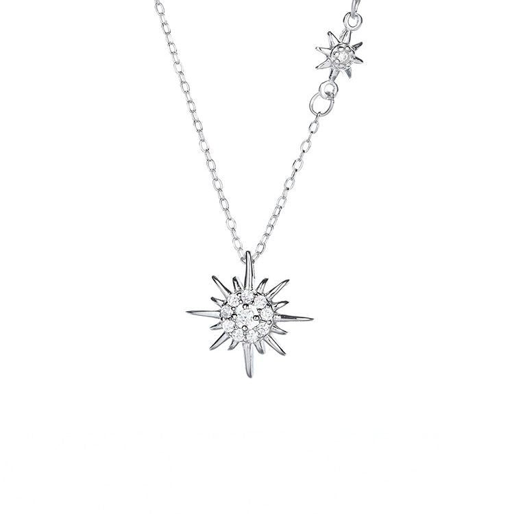 925 silver star pendant necklace displayed on a white background, showcasing its design and elegance in a minimalist setting. 