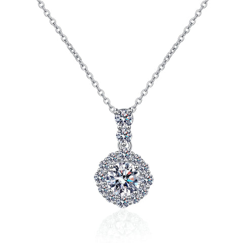 The 925 silver 1 carat round moissanite pendant necklace displayed on a white background, emphasizing its elegant design and quality craftsmanship.