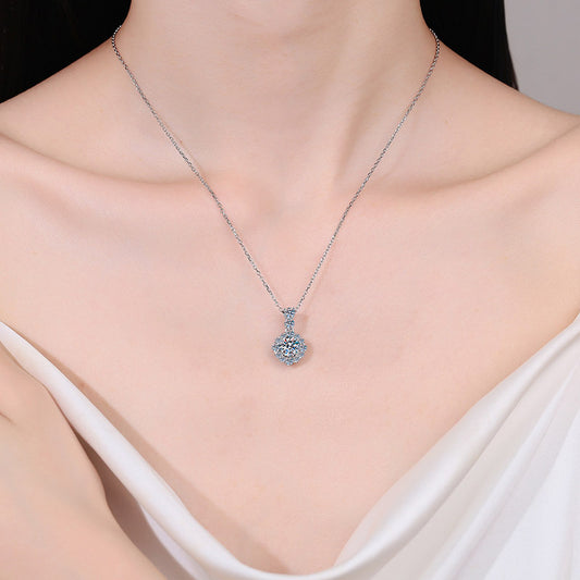 Model wearing the 925 silver pendant necklace with a 1 carat round moissanite stone, demonstrating its stylish appearance and versatility for various occasions.