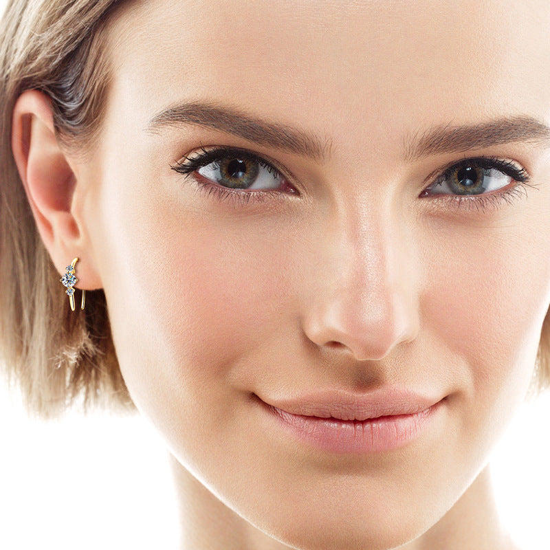  Model wearing 925 silver 14k gold-plated moissanite ear hanging, demonstrating how the earrings complement various styles and enhance the overall look.