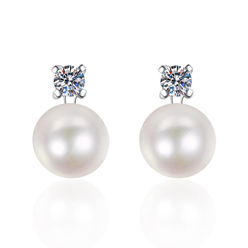 925 silver inlaid moissanite with natural pearl stud earrings displayed on a white background, emphasizing their exquisite design and noble aesthetic.
