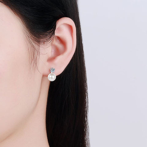 Model wearing the 925 silver moissanite and natural pearl stud earrings, illustrating their elegance and perfect sparkle in an everyday setting.