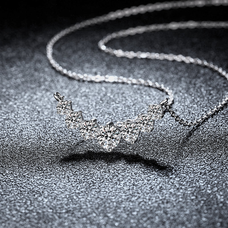 Side view of the 925 silver inlaid seven moissanite pendant necklace, highlighting the elegant profile and intricate detailing.