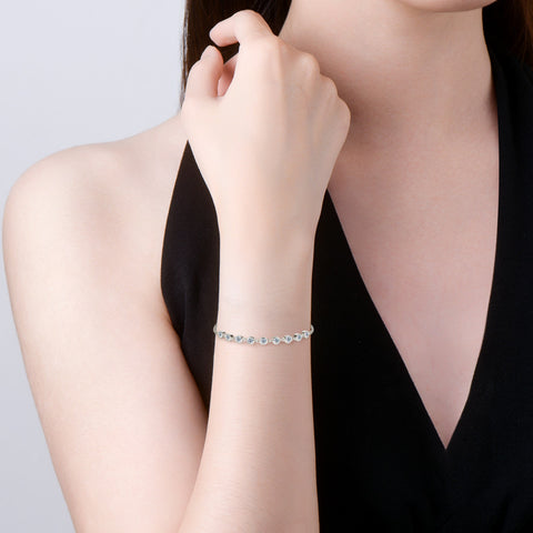 The 925 Silver Plated 18k Gold Moissanite Bracelet worn on a wrist, illustrating its luxurious style and fit.