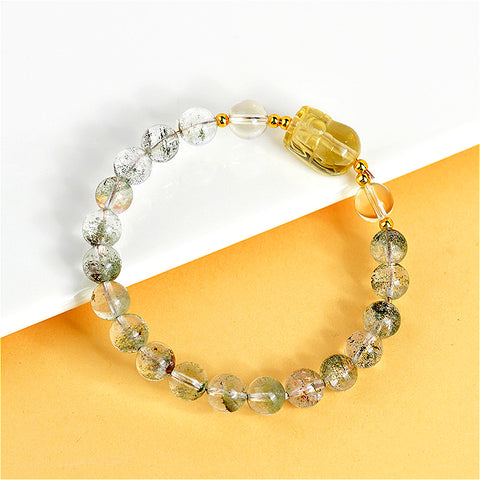  Close-up detail of the Natural Green Ghost Citrine Pixiu Bracelet, focusing on the texture of the citrine stones and the craftsmanship of the Pixiu.