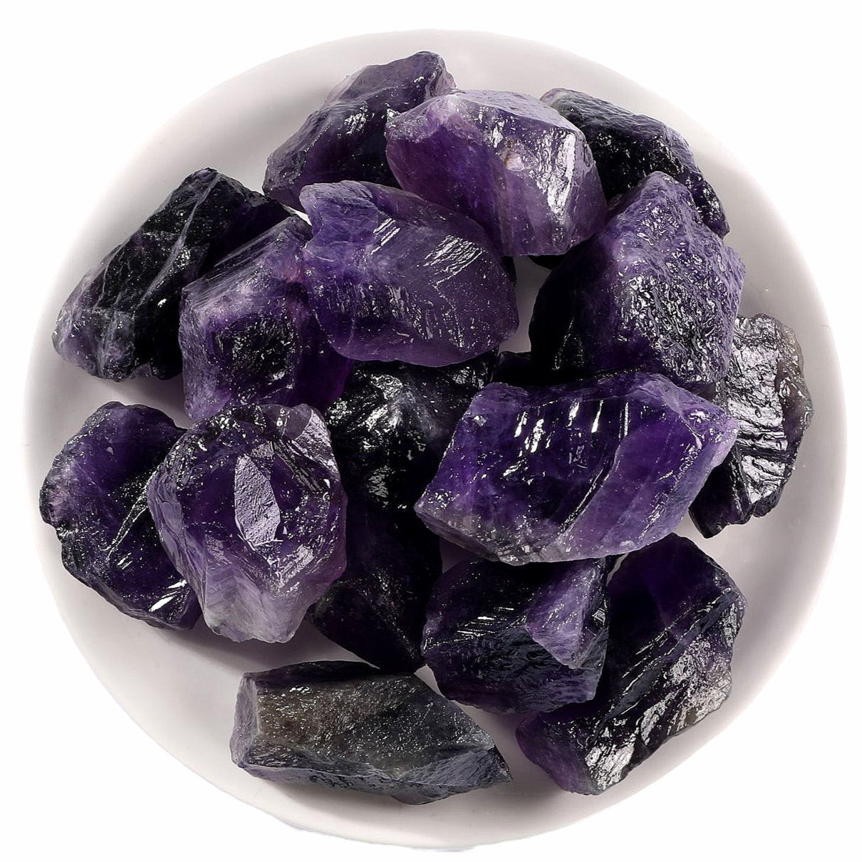  The Natural Amethyst Rough Stone placed against a white background, allowing the stone's vibrant purple color and unique features to stand out prominently.
