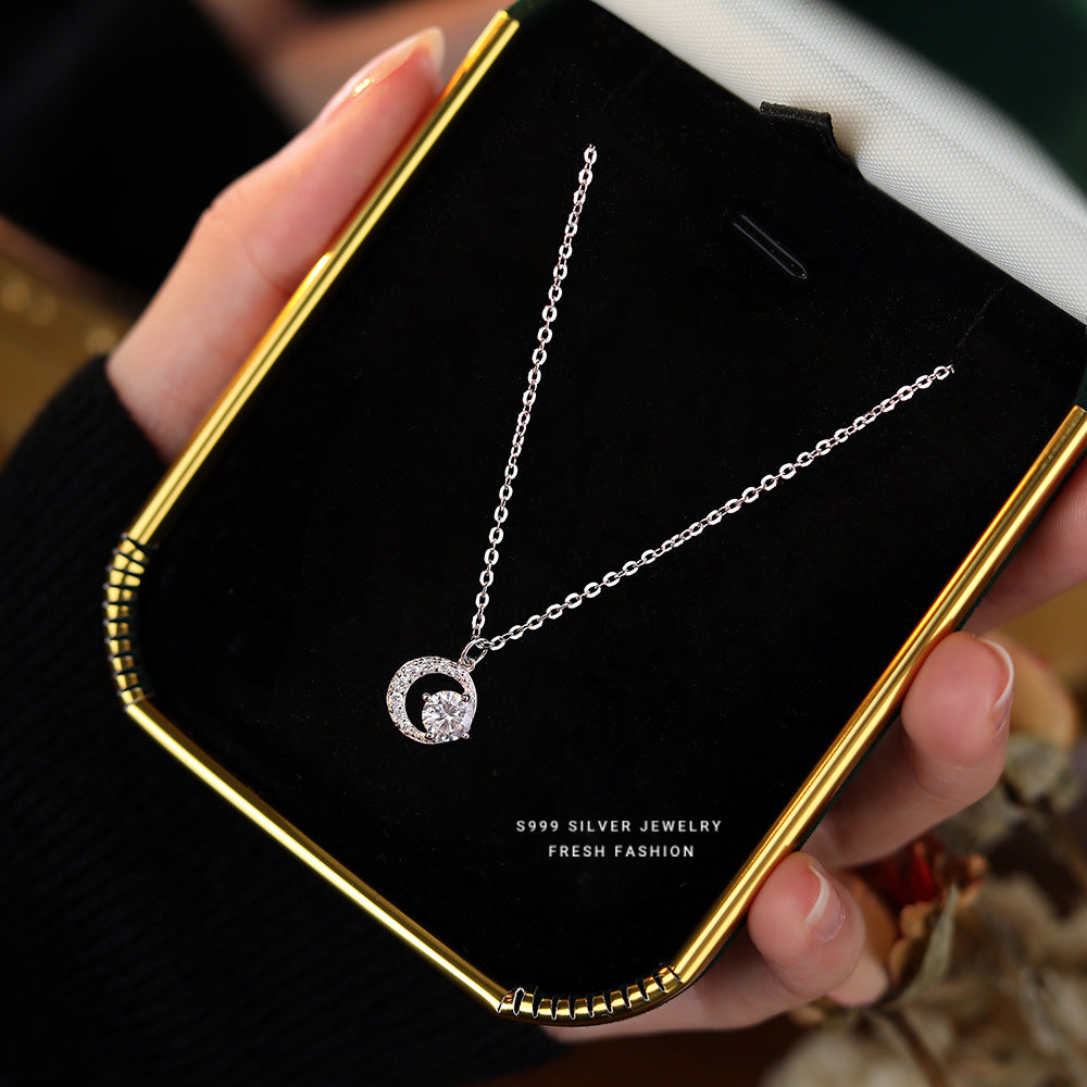 Front view of the 999 Silver Crescent Moissanite Pendant Necklace, featuring a beautifully designed crescent moon adorned with shimmering moissanite, capturing the essence of elegance in moonlight.