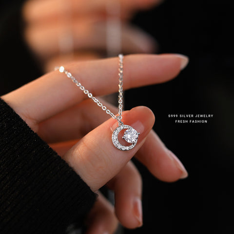 Model elegantly wearing the 999 Silver Crescent Moissanite Pendant Necklace, demonstrating its versatility and refined style for both casual and formal occasions.