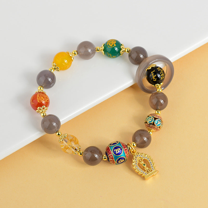 Side view of the Five-way God of Wealth Bracelet, highlighting the elegant arrangement of five-color agate and the intricately designed colored diamond pestle pendant.