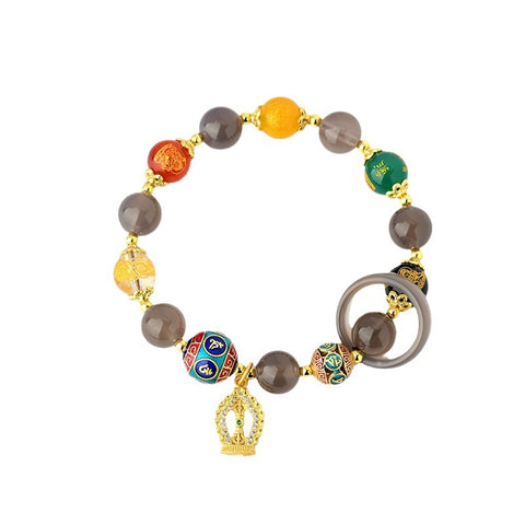 The Five-way God of Wealth Bracelet displayed against a white background, allowing the colors of the agate and the brilliance of the colored diamond pendant to stand out. 
