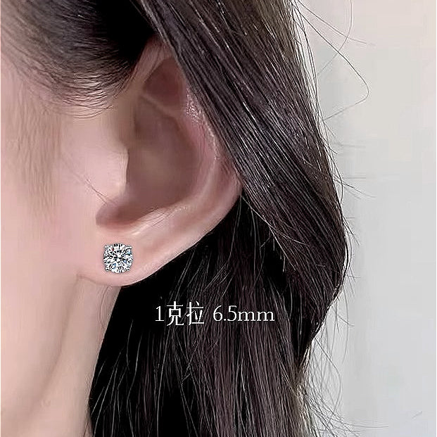 Model wearing Classic 925 Sterling Silver Four-Claw Moissanite Stud Earrings, illustrating their timeless elegance and how they effortlessly complement any outfit