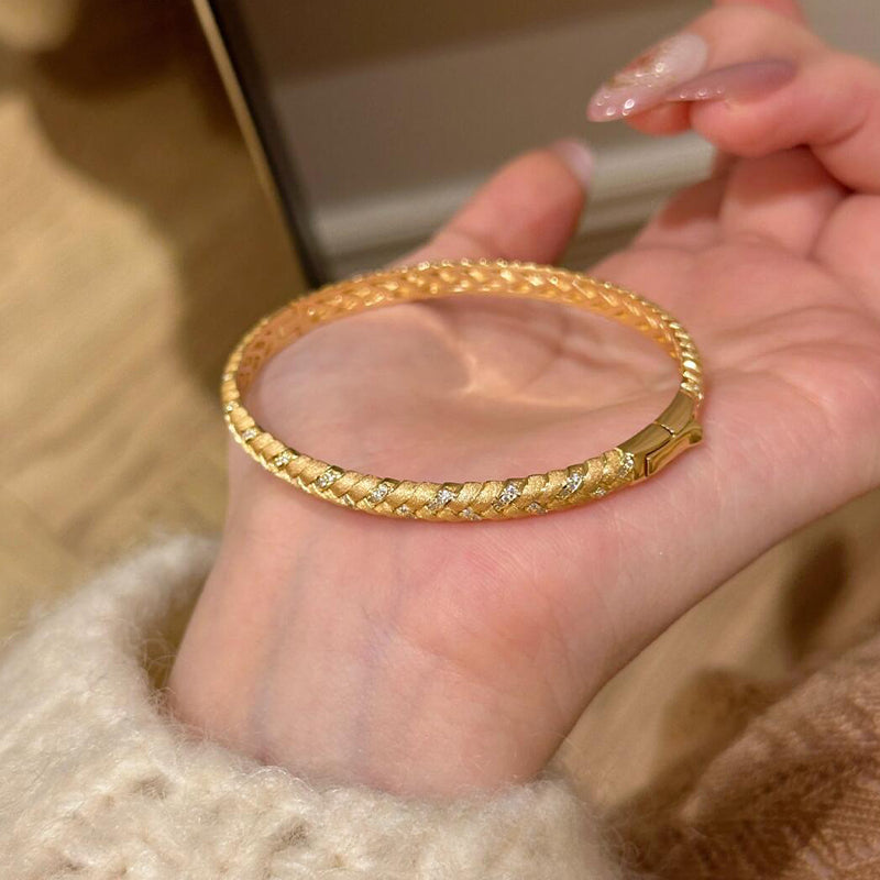  Model displaying gold-plated wheat cuff bracelet with zircon stones shining in sunlight