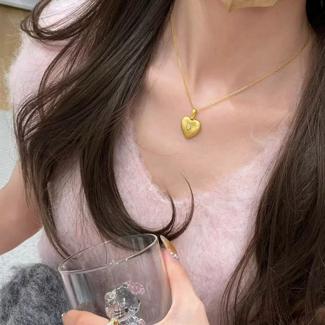 Model wearing the vintage-inspired 925 silver gold-plated heart pendant necklace with diamond accent, showcasing its elegant design.