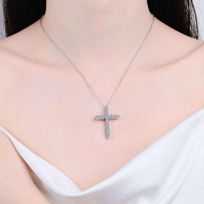 Model wearing a 925 sterling silver cross necklace with moissanite stones, demonstrating its beautiful appearance and stylish appeal in a real-life setting