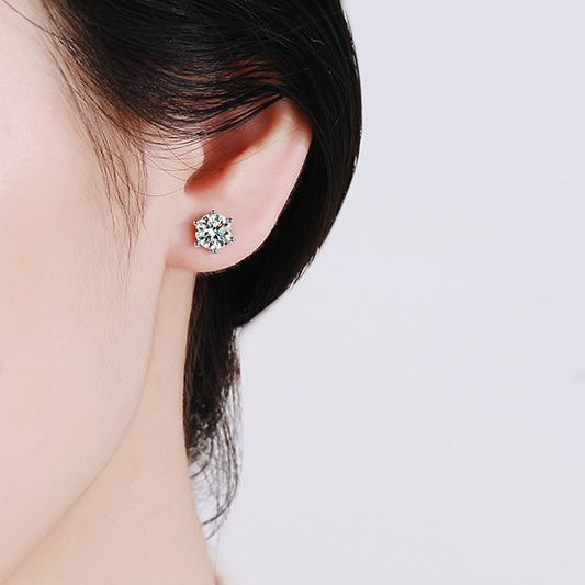 Model wearing Classic 925 Silver 1-Carat Moissanite Six-Claw Earrings, illustrating their luxurious appeal and how they complement any outfit, perfect for both day and night