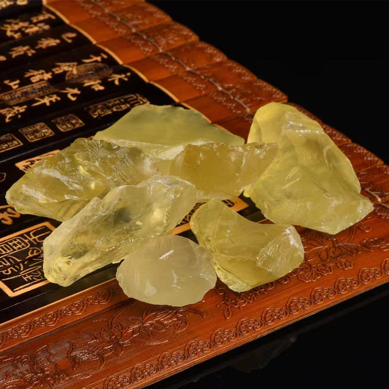  Side view of a natural citrine rough stone highlighting its unique texture and dimensions, illustrating its raw beauty.