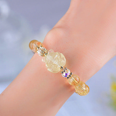 Natural Citrine and White Crystal Nine-tailed Fox Bracelet worn on a wrist, demonstrating its elegant design and fit.