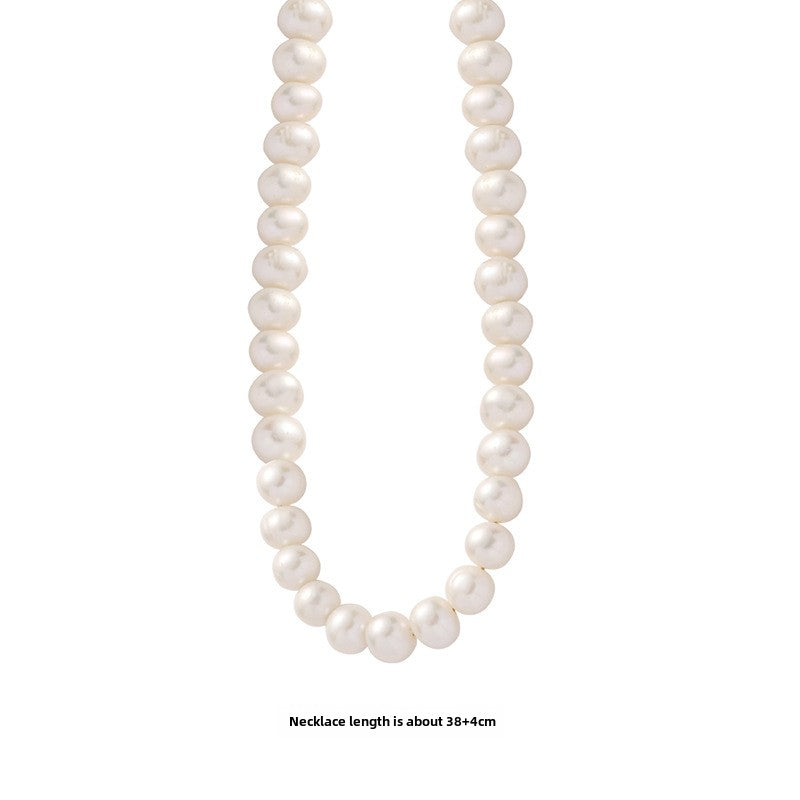  Natural freshwater pearl necklace displayed on a white background, showcasing the overall beauty and craftsmanship of the piece. 
