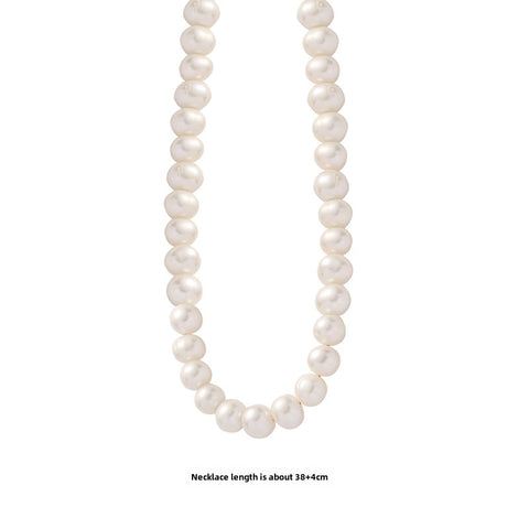  Natural freshwater pearl necklace displayed on a white background, showcasing the overall beauty and craftsmanship of the piece. 
