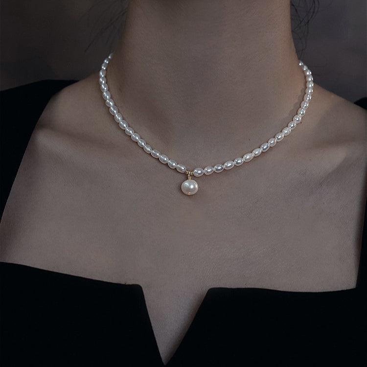 Model wearing the natural freshwater pearl pendant necklace, demonstrating its stylish look and versatility for any occasion.