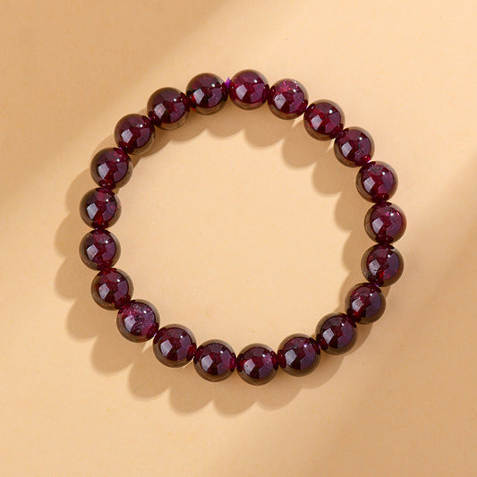 Front view of a natural garnet bead bracelet, showcasing its deep red beads and smooth finish, perfect for enhancing energy.
