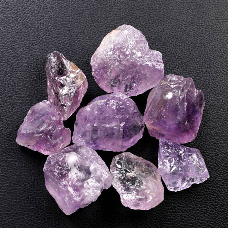  Front view of the Natural Lilac Rough Stone, showcasing its unique texture and soft lilac color, symbolizing spiritual healing and energy balance.