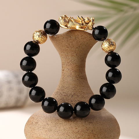 Front view of the Natural Obsidian Pixiu Bracelet, showcasing the sleek black obsidian beads and intricately carved Pixiu charm, symbolizing wealth attraction and protection.