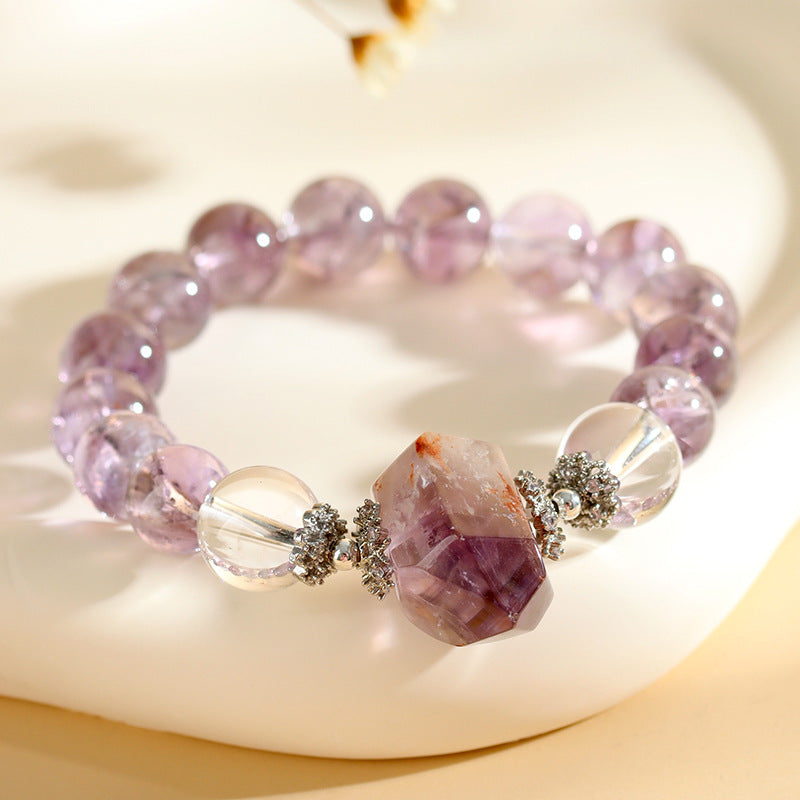  Close-up detail of the natural purple Asai crystal, white crystal, and purple ghost crystal bracelet, emphasizing the unique patterns and shimmering surfaces of each crystal.
