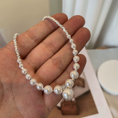 Close-up detail of the Nova Belle natural freshwater pearl broken silver necklace, focusing on the texture of the pearls and the craftsmanship of the silver elements.