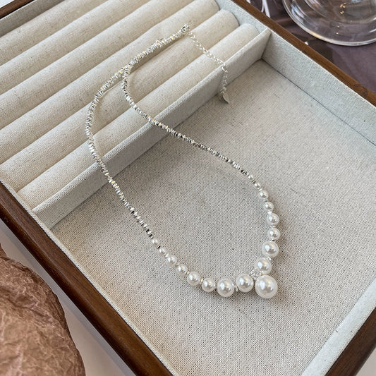 Front view of the Nova Belle natural freshwater pearl broken silver necklace, showcasing its unique design and lustrous pearls.