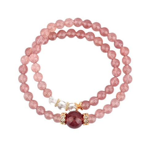  Peach Pink Natural Strawberry Crystal, White Crystal, and Garnet Double Bracelet on a white background, emphasizing its beautiful combination of elegance and energy.