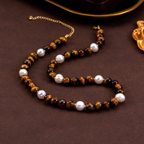 Side view of the Tiger's Eye Stone and Natural Pearl Necklace, highlighting its unique design and the arrangement of stones and pearls